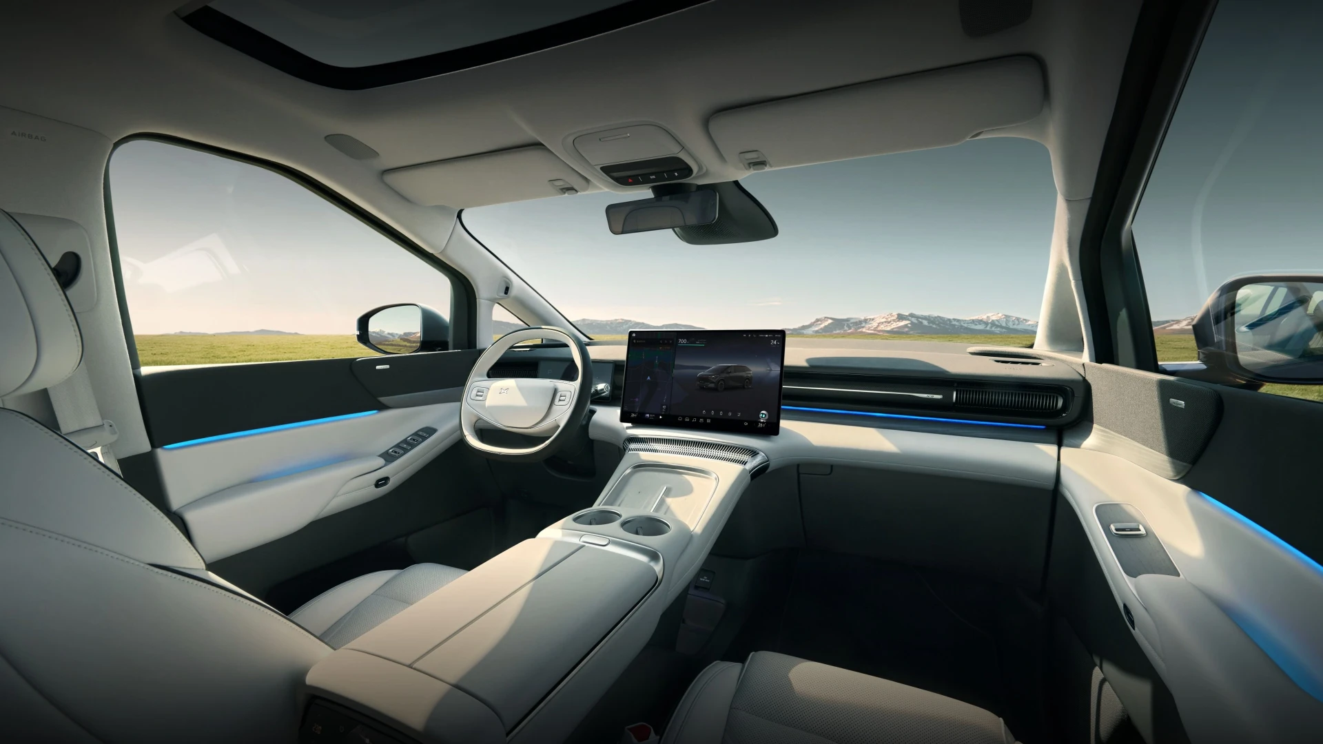 Interior view of a modern Chinese EV with smart screens and luxury seats